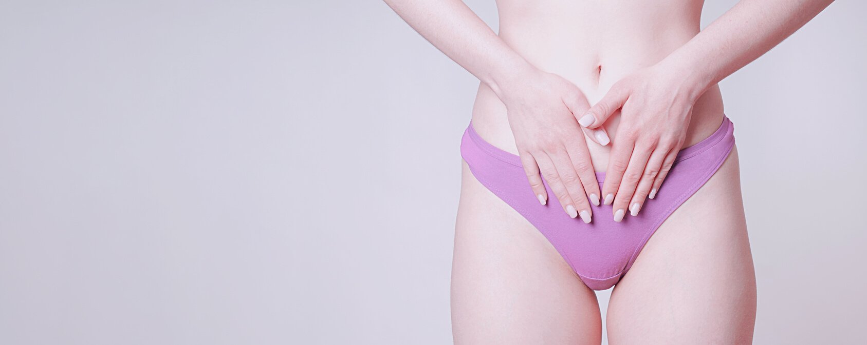 Woman in Pink Panties Touching Belly as Women's Health Concept