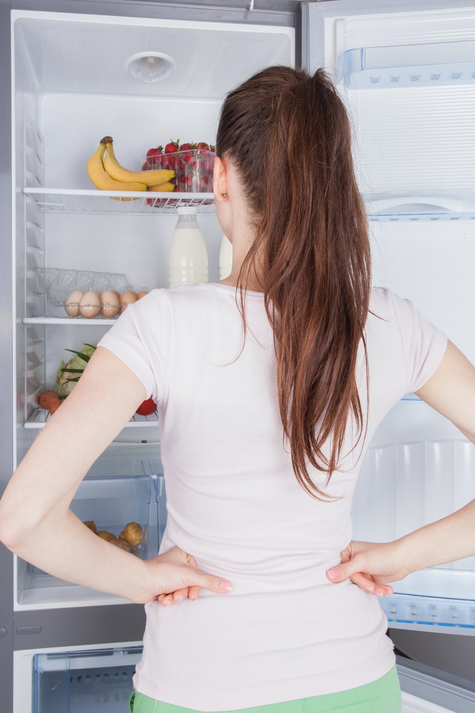 Young woman craving food choosing