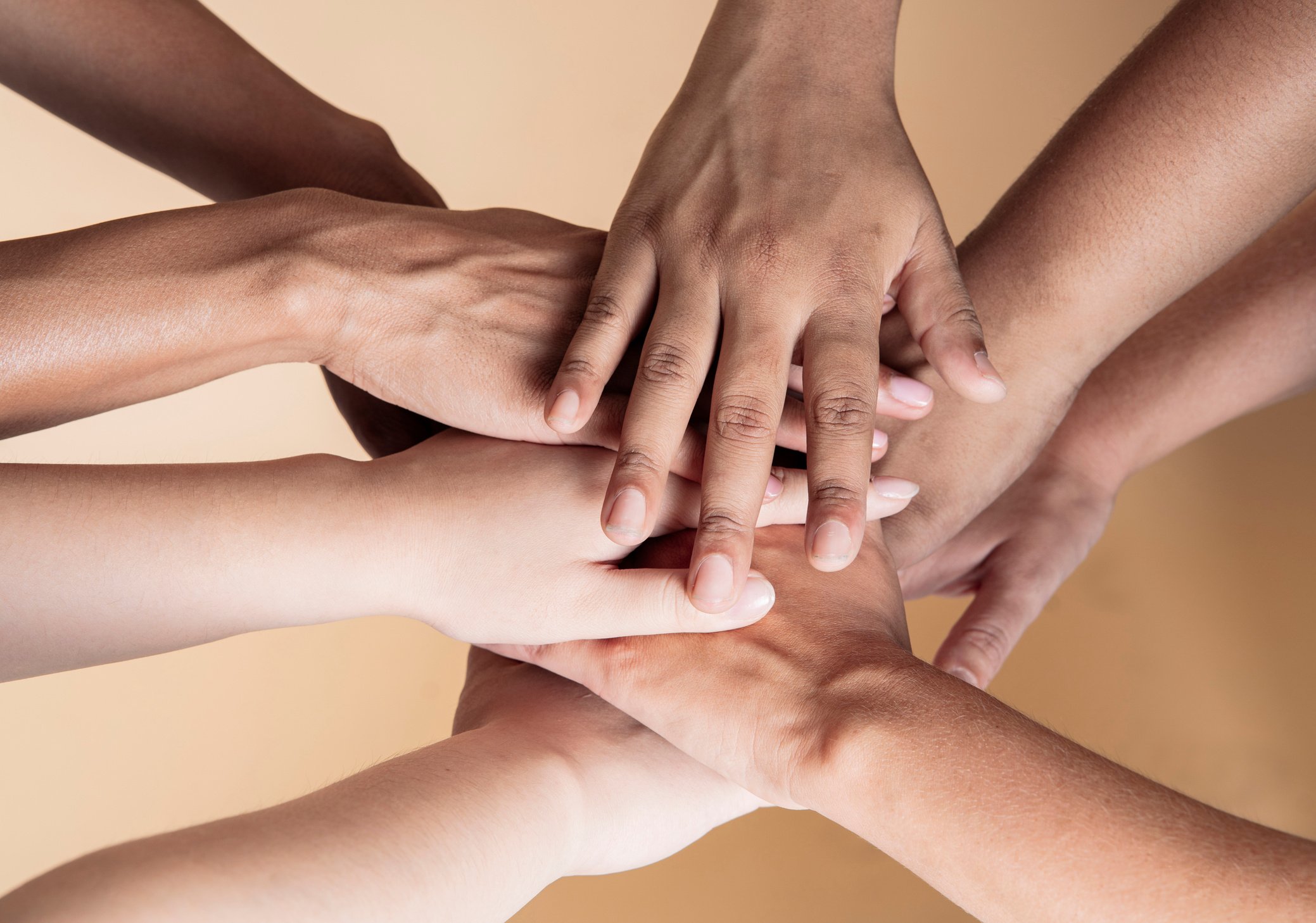 united hands of multiethnic women